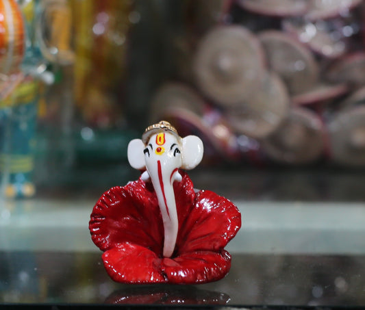 GANESHA WITH RED FLOWER